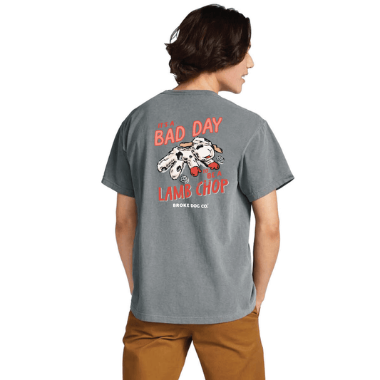 Comfort Colors unisex tee featuring "Bad Day to Be a Lamb Chop" graphic on a soft gray background.
