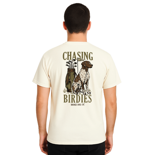 Back view of a cream t-shirt featuring a German Shorthaired Pointer and golf clubs with 'Chasing Birdies' text.