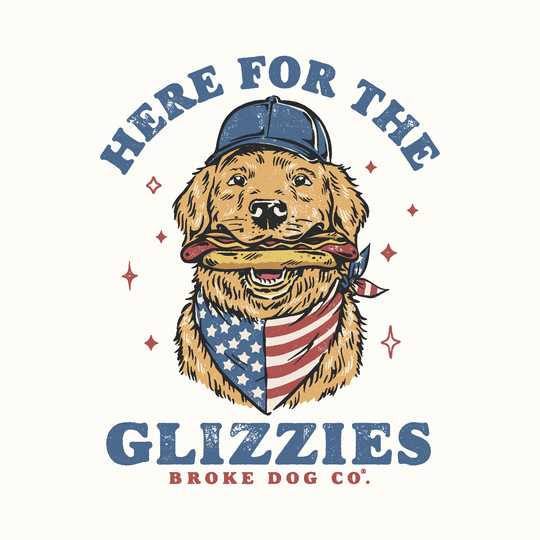 Illustration of a golden retriever wearing a cap and bandana, holding a hot dog, promoting 'Here for the Glizzies' t-shirt.