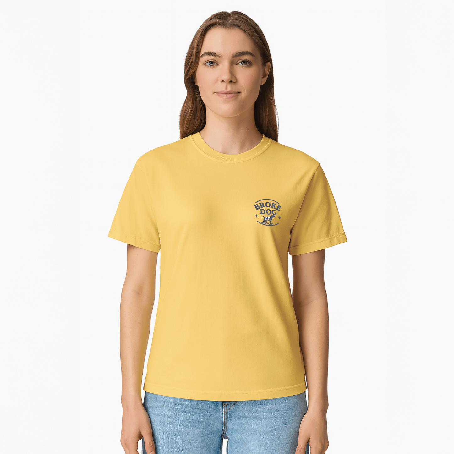 Woman wearing a yellow t-shirt featuring the Broke Dog Co. logo on the chest.