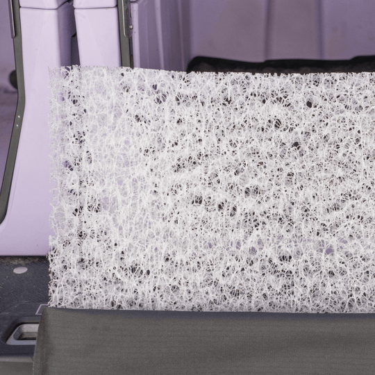 Close-up of the Broke Dog Venture Pro Kennel Pad insert, showcasing its waterproof and durable material in a kennel.